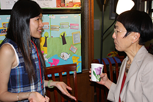 Student talking to a professor at an Intercultural Center event